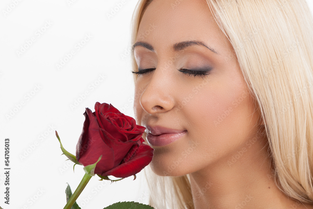 Smelling a flower. Portrait of beautiful young women smelling a Smelling a flower. Portrait of beautiful young women smelling a