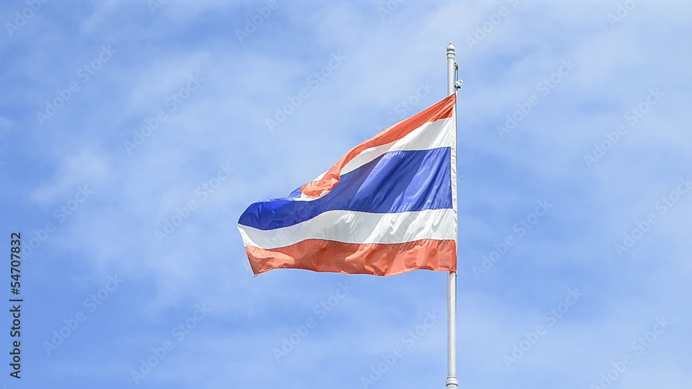 old thailand flag blowing on flagstaff old thailand flag blowing on flagstaff