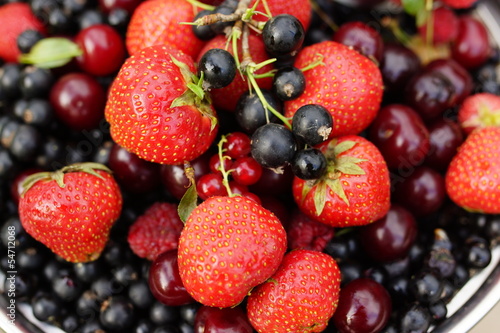Fototapeta Naklejka Na Ścianę i Meble -  sweet summer berries: strawberries, cherry, currant, raspberry
