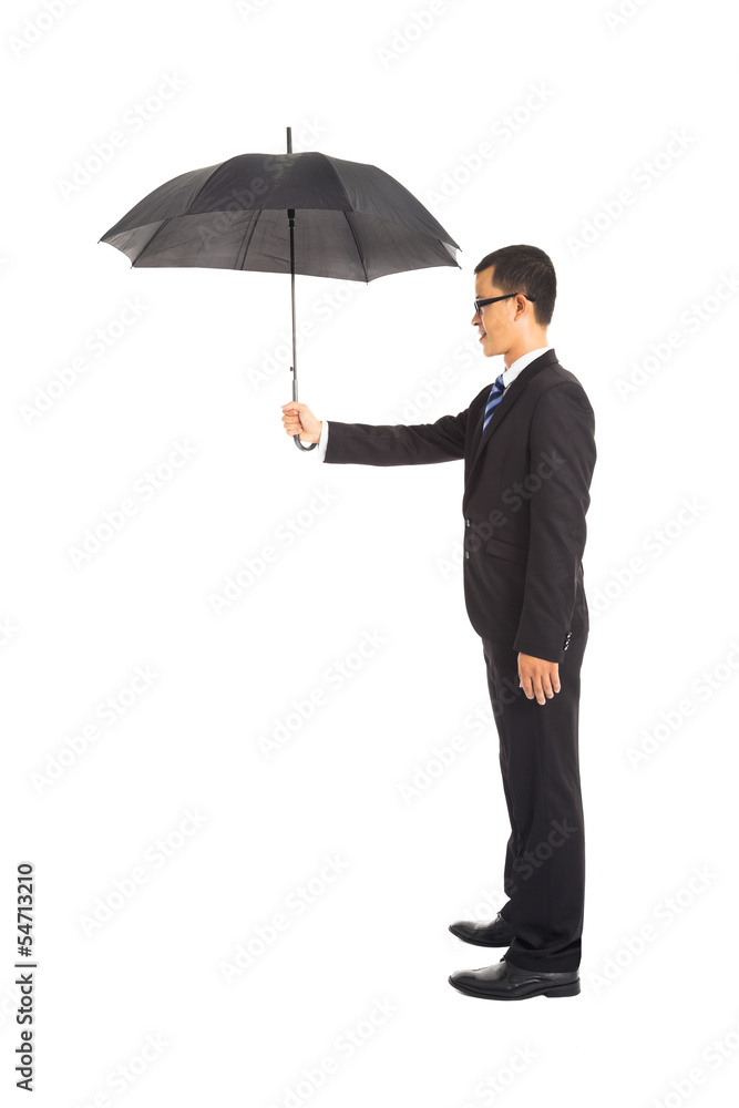 smiling businessman holding umbrella standing smiling businessman holding umbrella standing