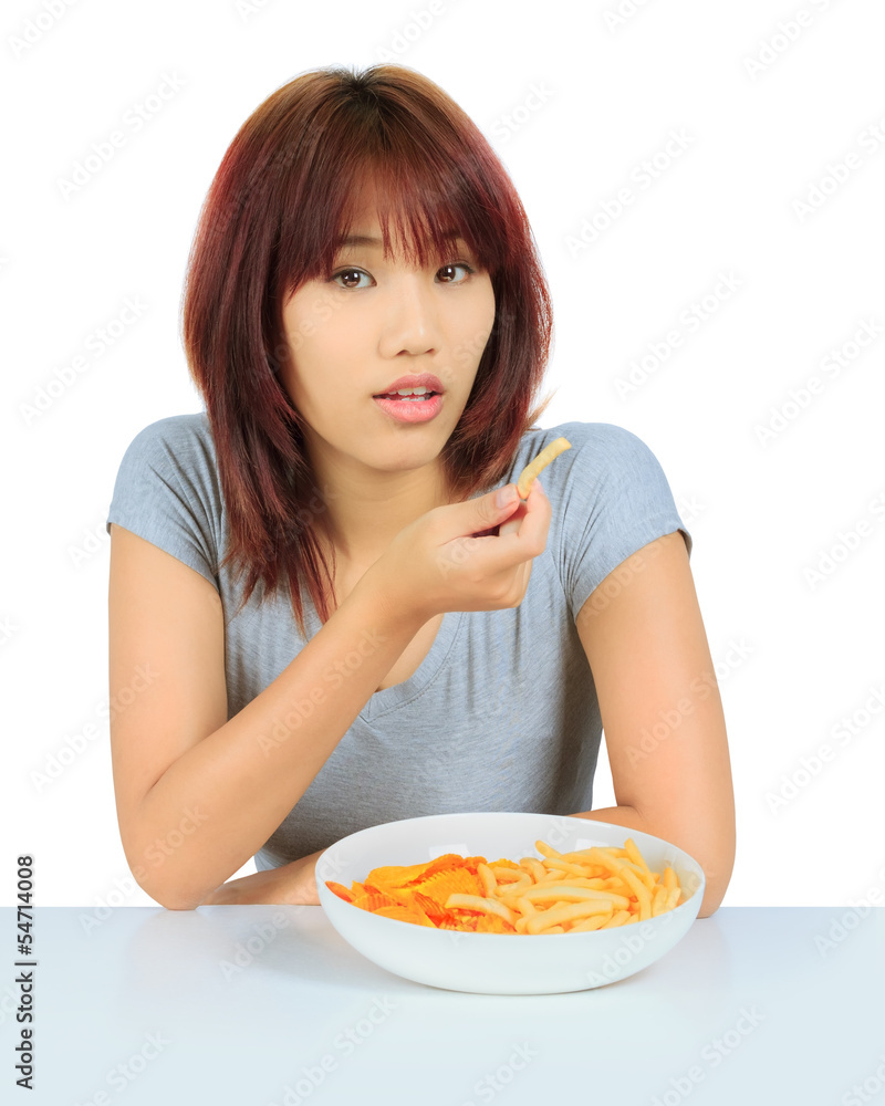 Isolated young asian woman with a plate of potato chips and fren Isolated young asian woman with a plate of potato chips and fren