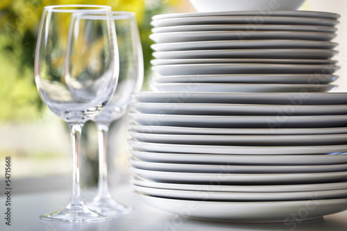 White plates and wine glasses