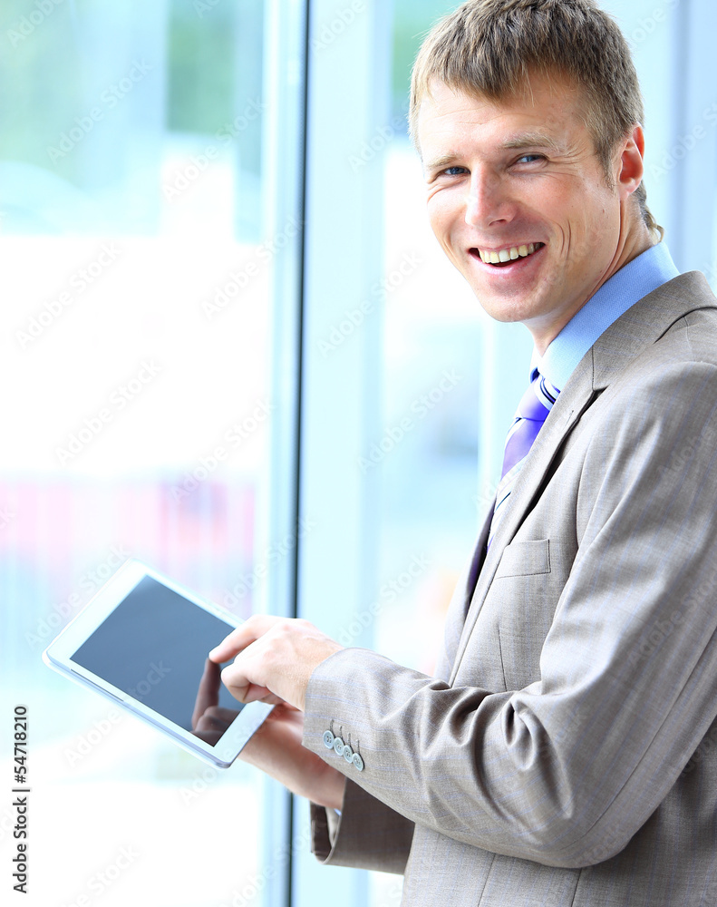 Portrait of a businessman working on his tablet Portrait of a businessman working on his tablet
