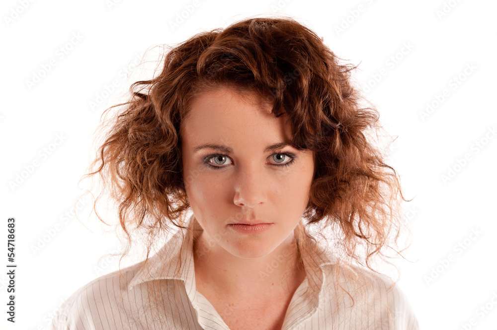 Young short haired woman looking seriously toward the camera Young short haired woman looking seriously toward the camera