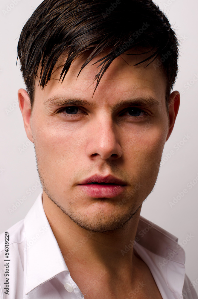 Obraz premium Portrait of a beautiful man posing fashion in a studio