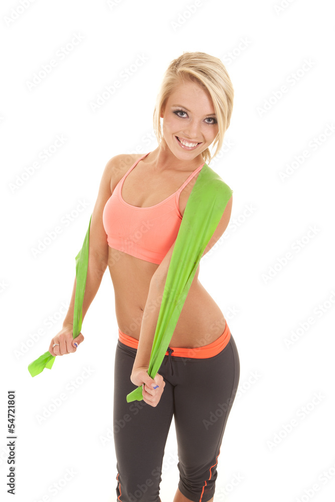 woman fitness green stretch band around shoulders woman fitness green stretch band around shoulders