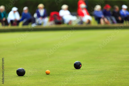 Lawn bowls match with distant spectators