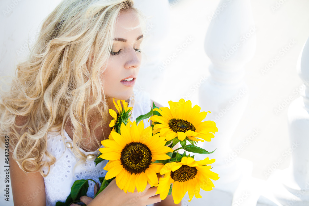 portrait of attractive woman with sunflowers in her hand portrait of attractive woman with sunflowers in her hand