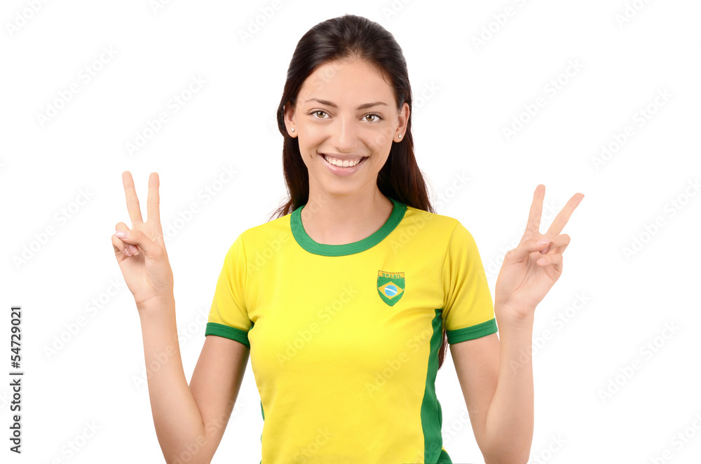 Girl with Brazilian flag on her shirt signing victory for Brazil Girl with Brazilian flag on her shirt signing victory for Brazil