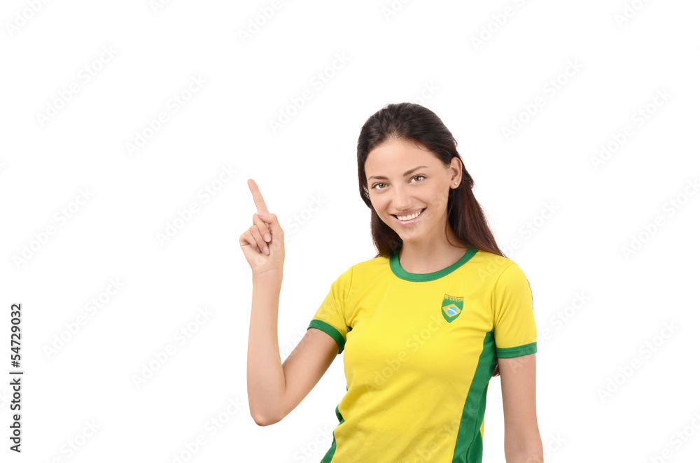 Girl with Brazilian flag on her shirt pointing up. Girl with Brazilian flag on her shirt pointing up.