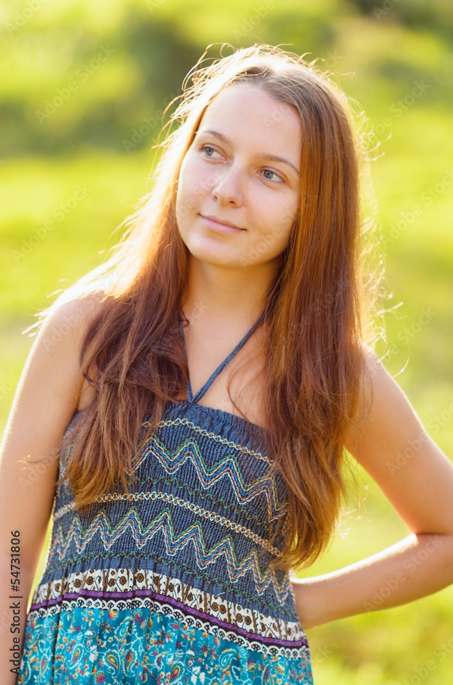 Portrait of young beautiful woman outdoors