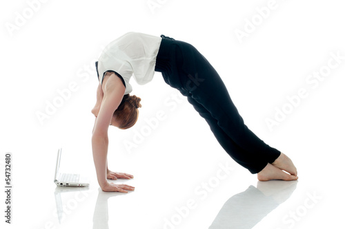 Business lady doing gymnastics and posing with PC