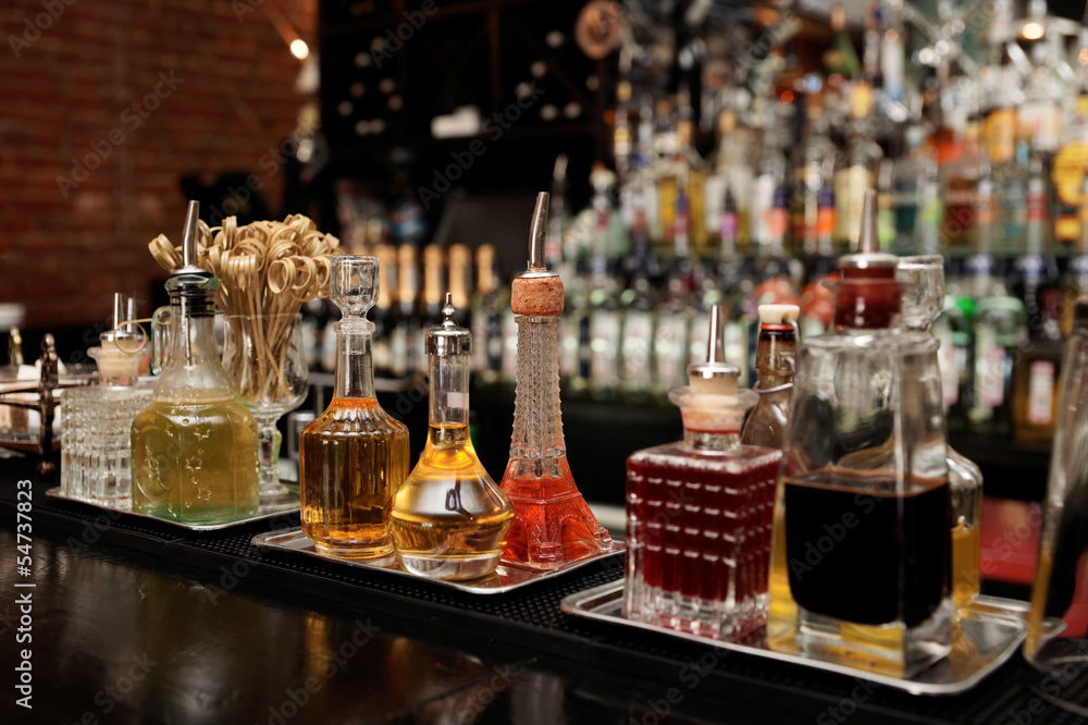 Bitters and infusions on bar counter Bitters and infusions on bar counter