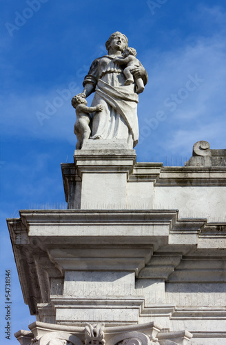 Statue at the Top of a Neoclassic Building