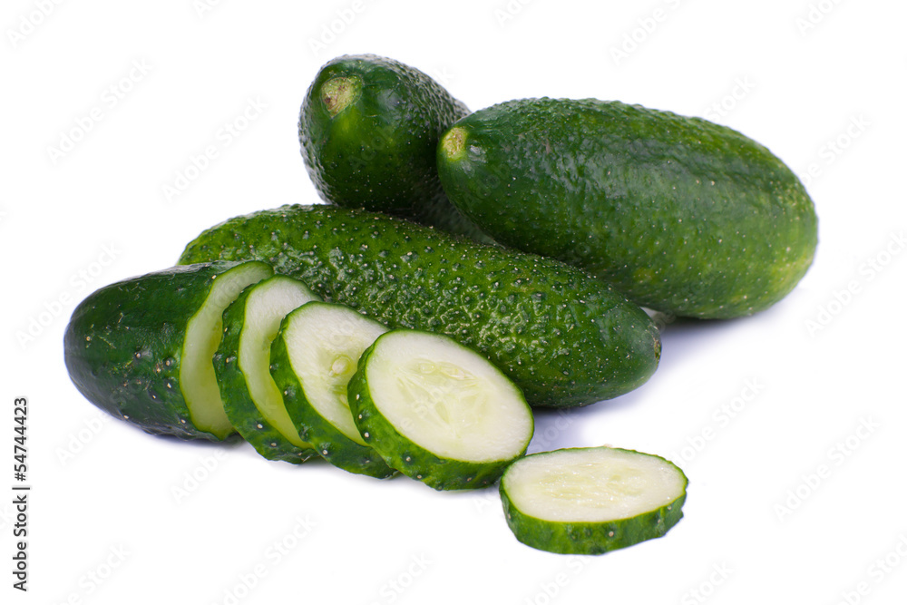 Cucumber and slices isolated over white background Cucumber and slices isolated over white background