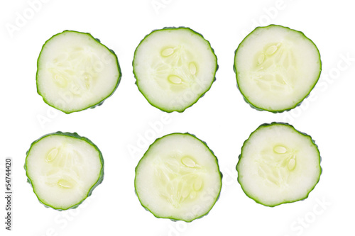 Six cucumber slices isolated on white background