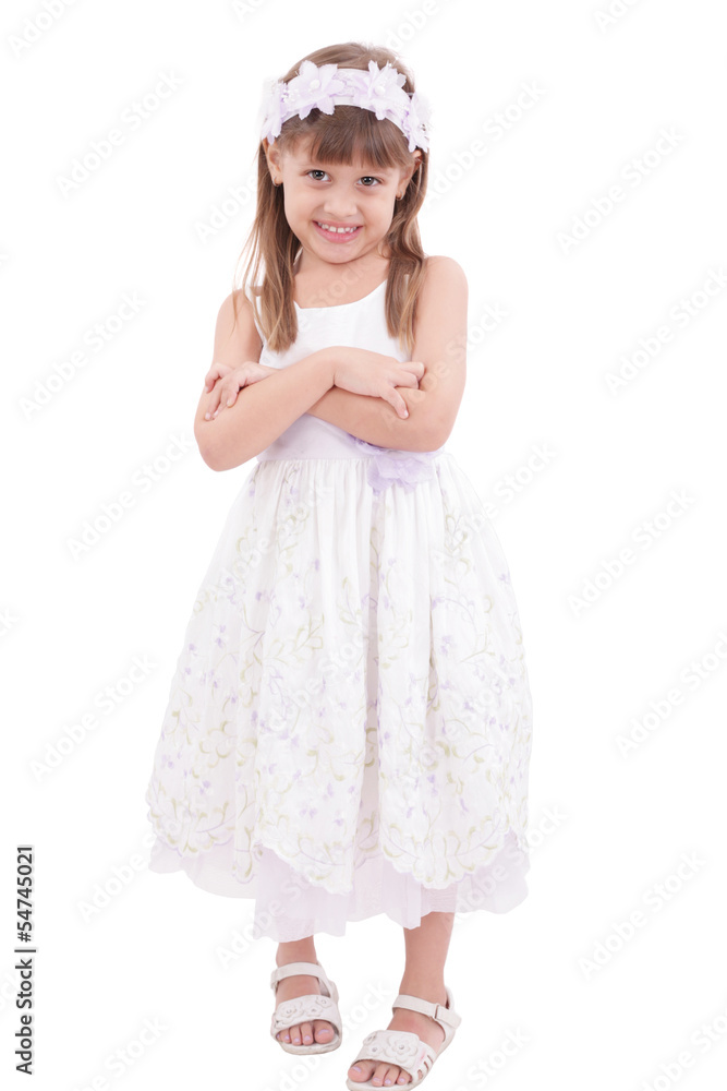 Full length portrait of a little girl standing with folded hands Full length portrait of a little girl standing with folded hands