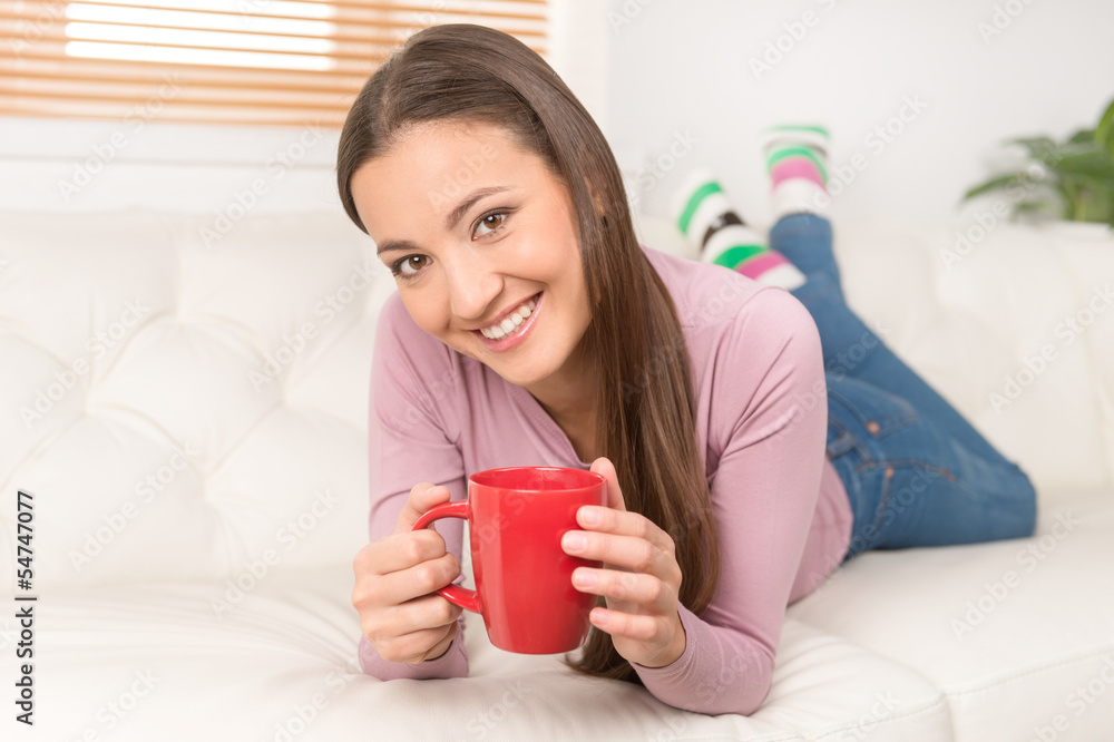 Women with cup of coffee. Cheerful young women drinking coffee a