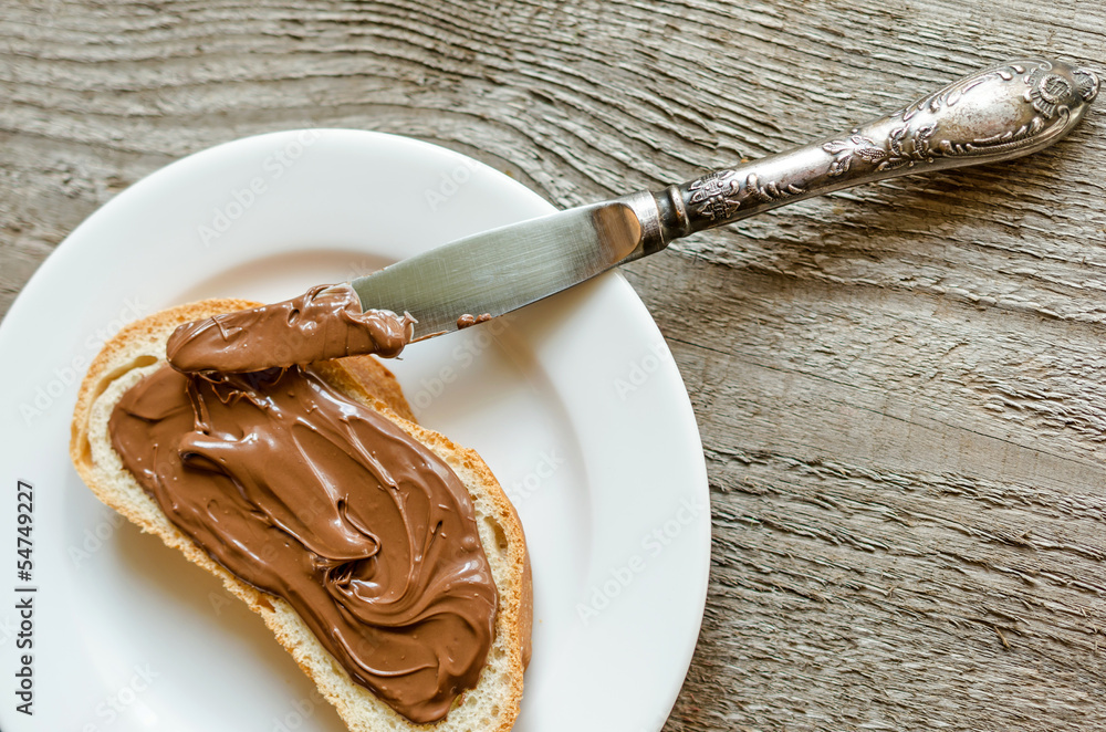 Fototapeta premium Slice of bread with chocolate cream