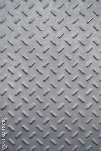 Patterned grey metal door texture © CurvaBezier
