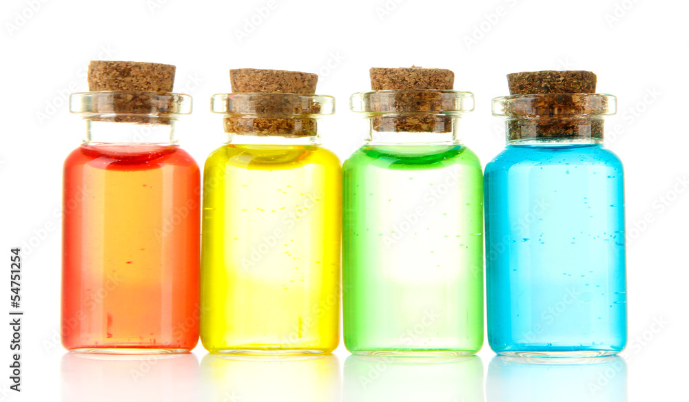 Bottles with colored liquids isolated on white Bottles with colored liquids isolated on white