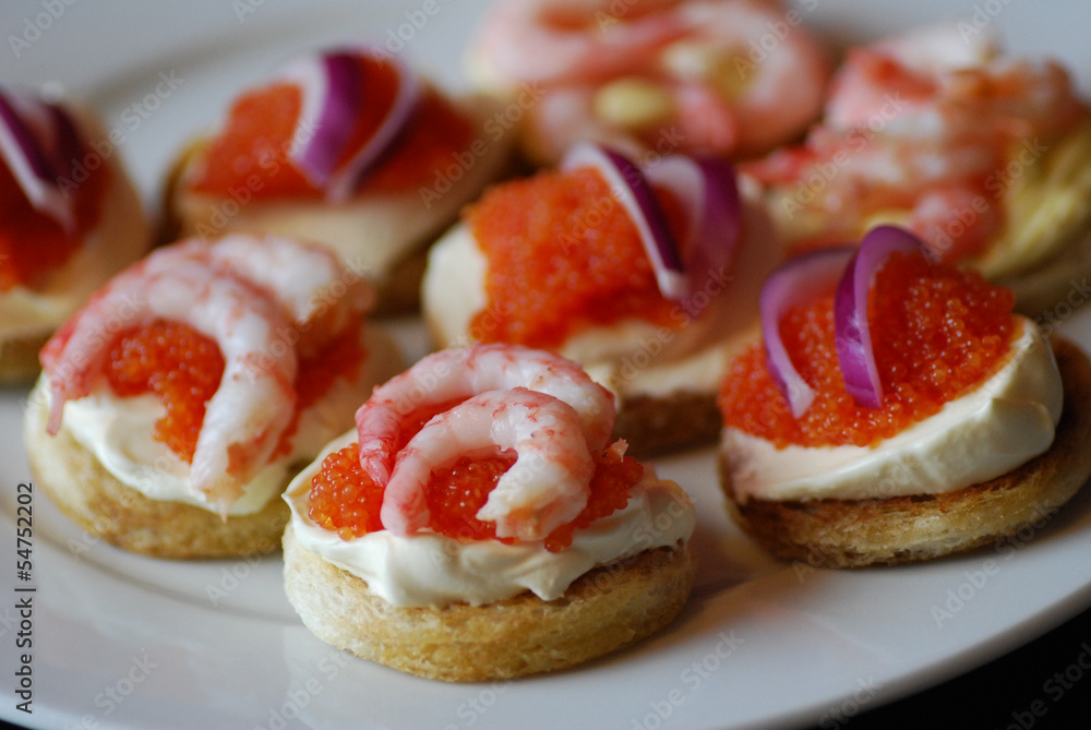 luxury appertizers with caviar and shrimps on a plate luxury appertizers with caviar and shrimps on a plate