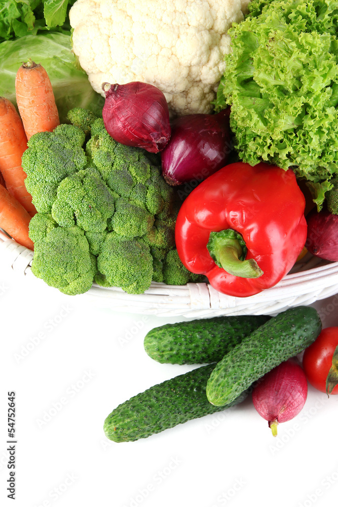 Fresh vegetables in white wicker basket close up Fresh vegetables in white wicker basket close up