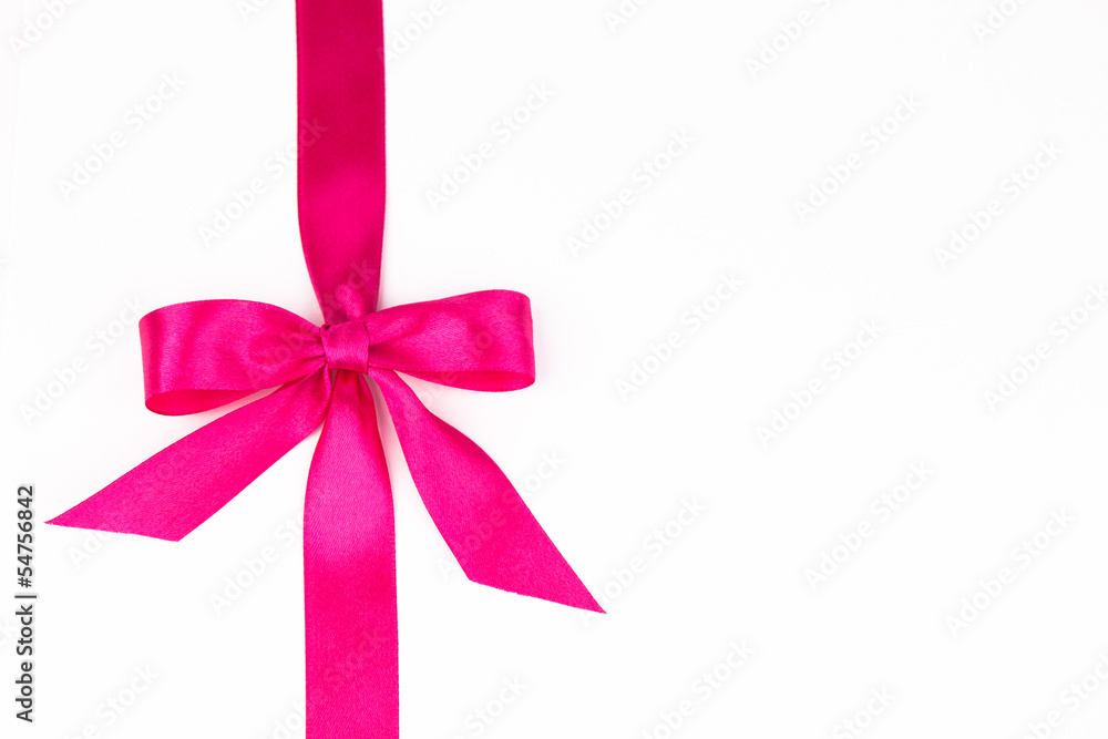 Pink bow with a ribbon isolated on a white backgrounds Pink bow with a ribbon isolated on a white backgrounds