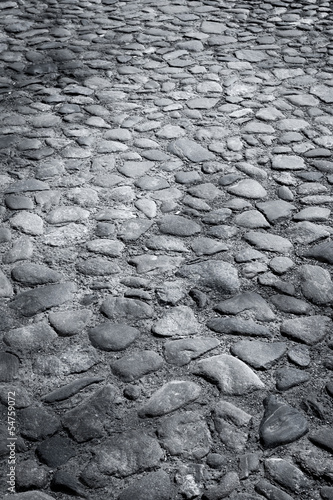 Closeup background texture of cobblestone road