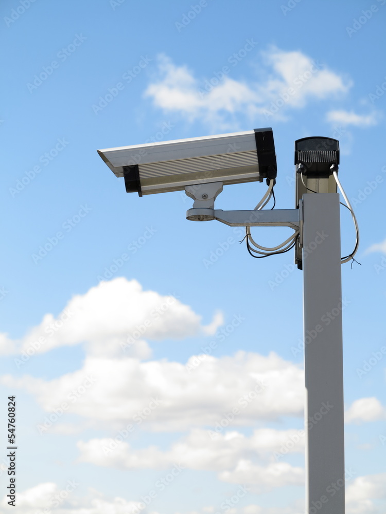 Security camera cctv over blue sky Security camera cctv over blue sky