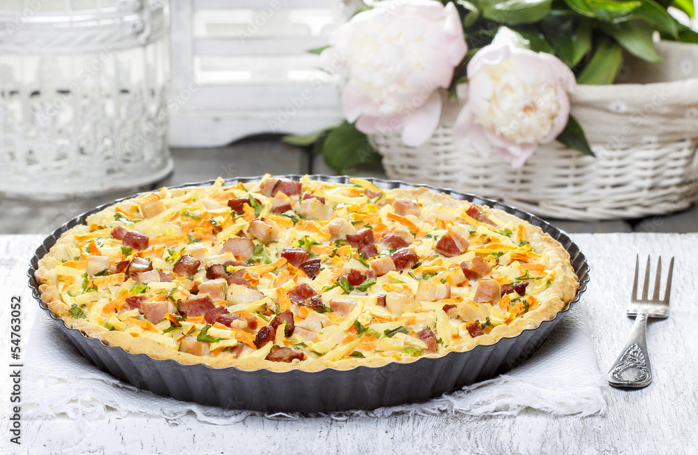 Big vegetable tart on wooden table Big vegetable tart on wooden table