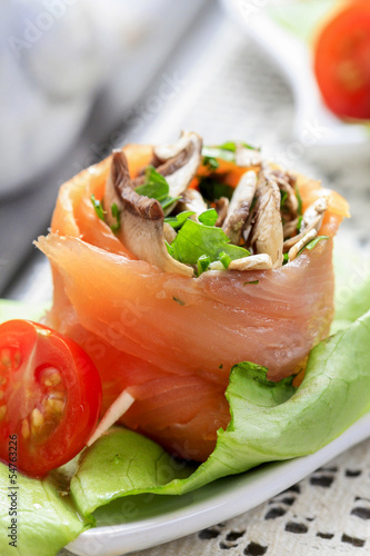 Salmon appetizer filled with mushrooms, very soft and selective