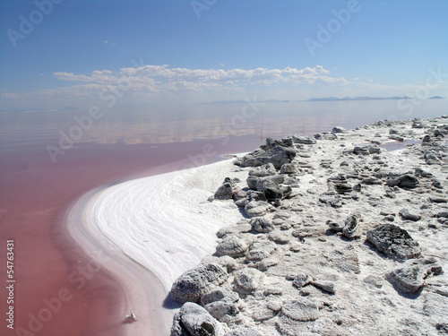 The salty shore of the great Salt Lake with mountains in the bac