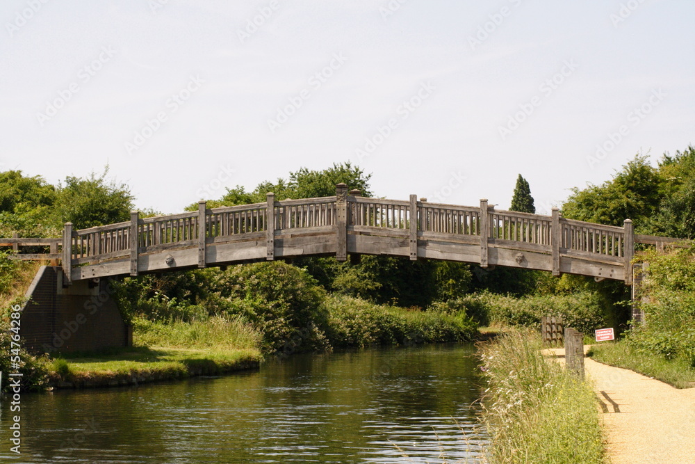 Tudor Style wooden bridge over river 