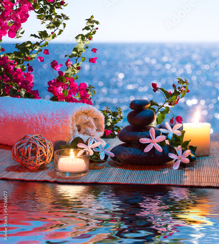 Candles - black stones and tiare - Bougainvillea on water