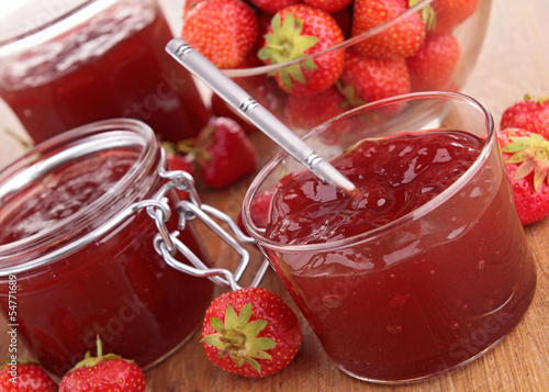 strawberry jam on wood background