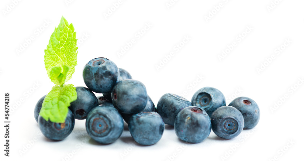 Fresh blueberry with green leaves of mint on white background Fresh blueberry with green leaves of mint on white background