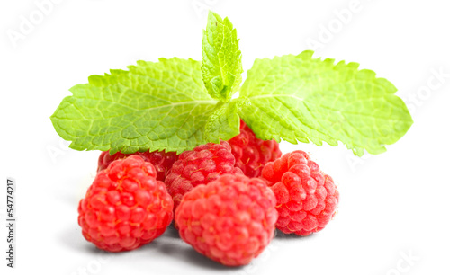 ripe red raspberry with mint leaves