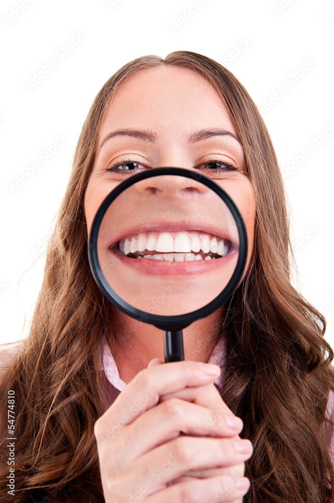 Woman showing her teeth thrue magnify Woman showing her teeth thrue magnify