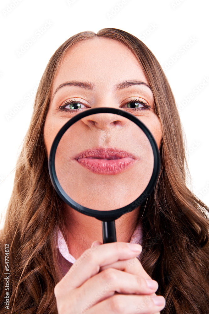 Female with magnifying glass showing mouth over white Female with magnifying glass showing mouth over white