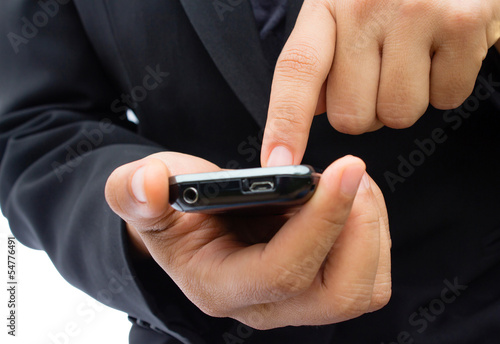 Flat cell phone in business man hand