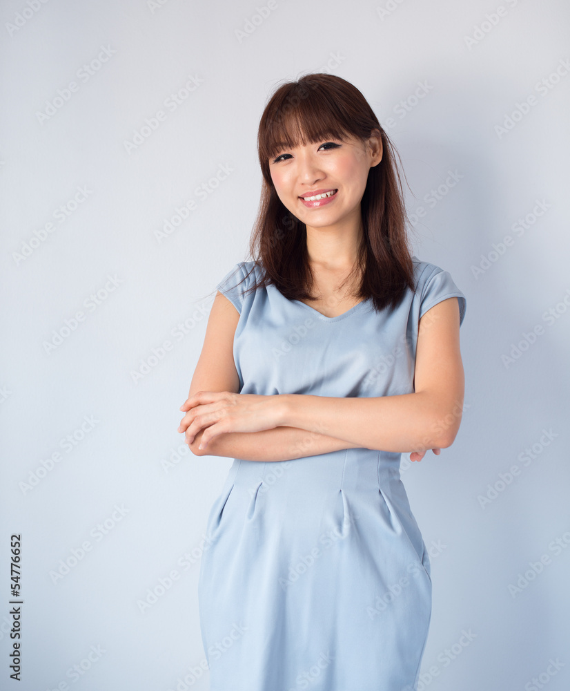 Asian woman isolated on blue background. Asian woman isolated on blue background.