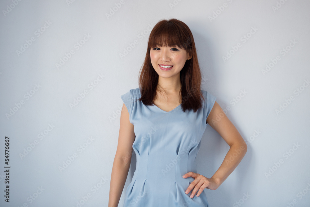 Cute Asian woman isolated on blue background. Cute Asian woman isolated on blue background.