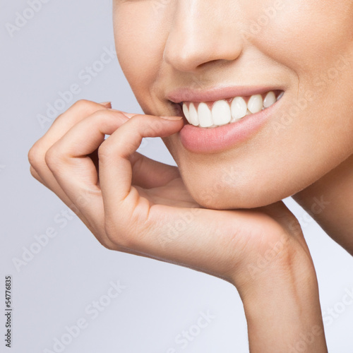 Smiling woman, on grey