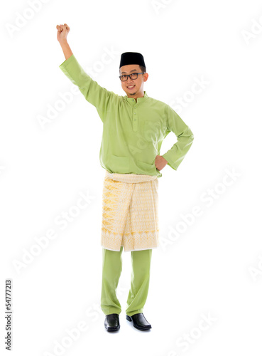 malay male jumping celebrating hari raya eid fitr after ramadan