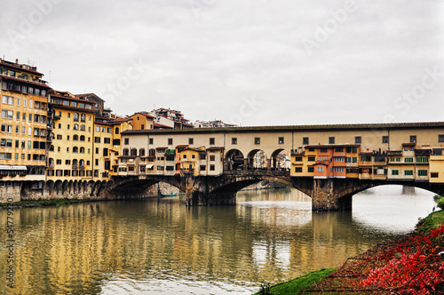 Florence with reflections in the Arno River. Italy
