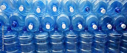 big empty water bottles at warehouse