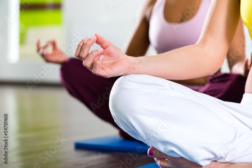 women in the gym doing yoga exercise for fitness photo