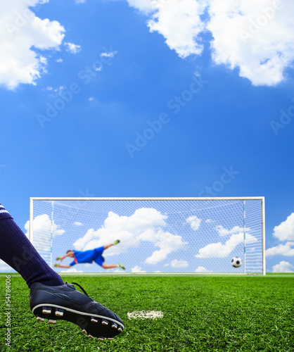 foot shooting soccer ball to goal, penalty