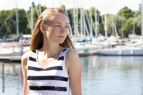 attractive girl in striped dress on the seashore